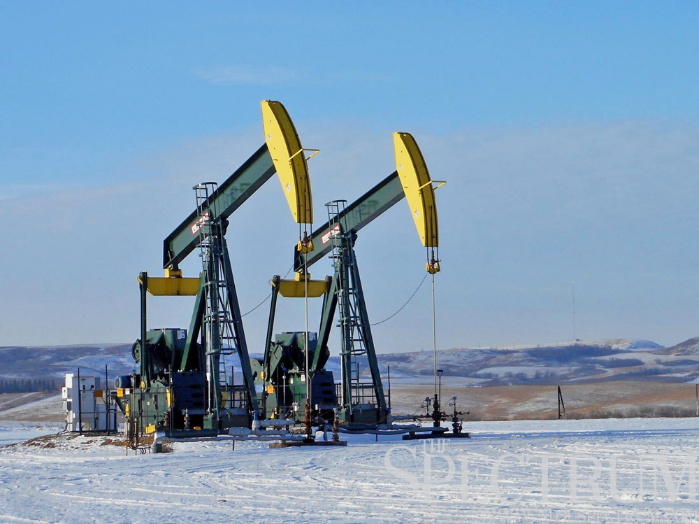 JACK DURA | THE SPECTRUM Hess Corporation pumpjacks nod away on a well pad south of Watford City, N.D., last month.