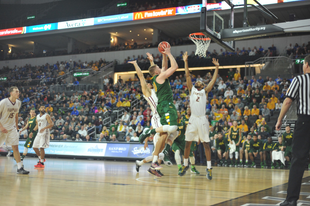 Dexter Werner drives to the basketball Sunday against IUPUI inside the Denny Sanford Premier Center. | Joseph A. Ravits