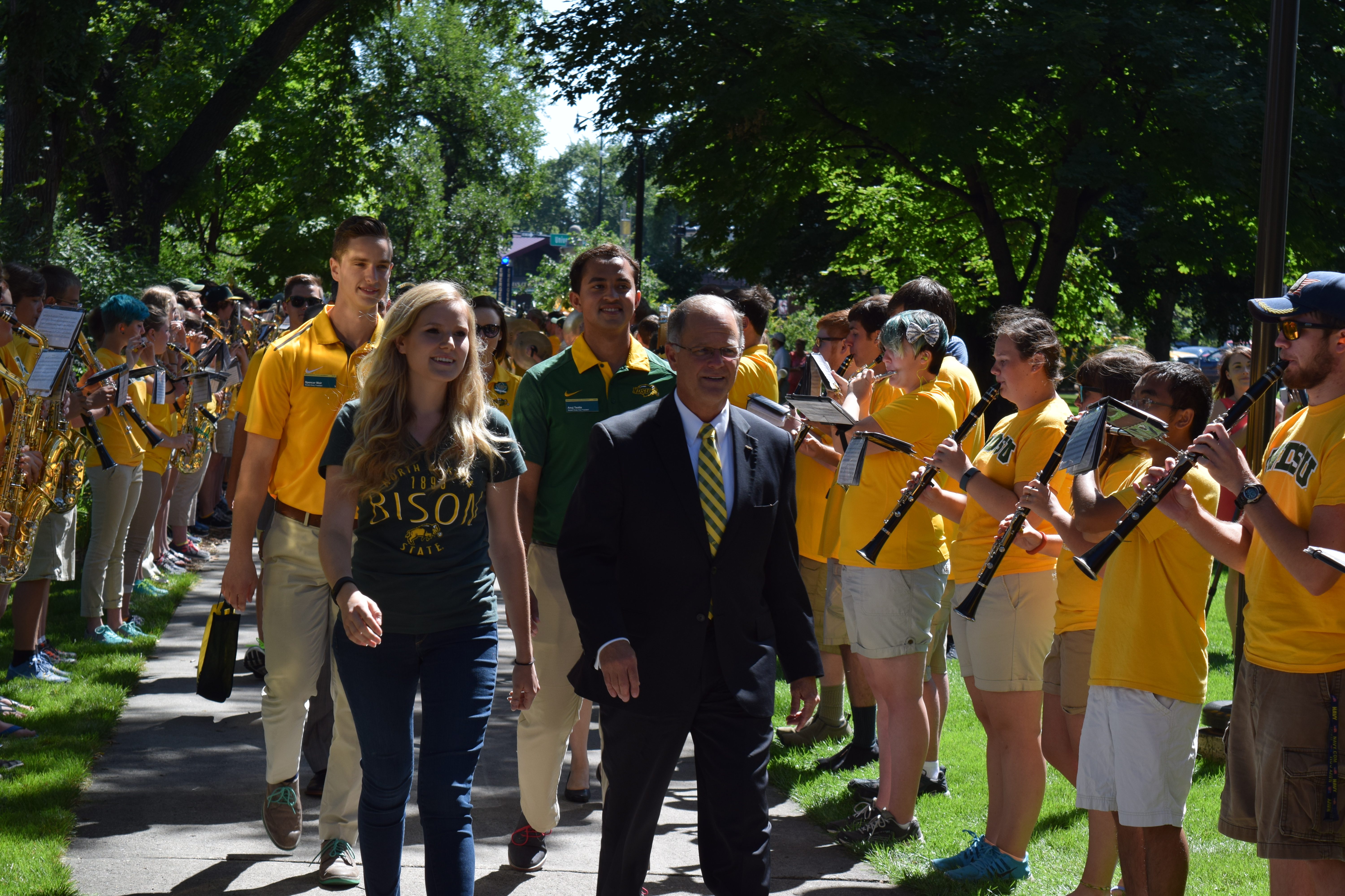 CASEY MCCARTY | THE SPECTRUM President Dean Bresciani leads the class of 2020 through the gates of NDSU.