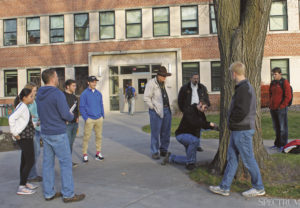 PHOTO COURTESY Rio Bergh | The Spectrum | Students and faculty look on as a core sample is drawn from a potential memory tree on campus.